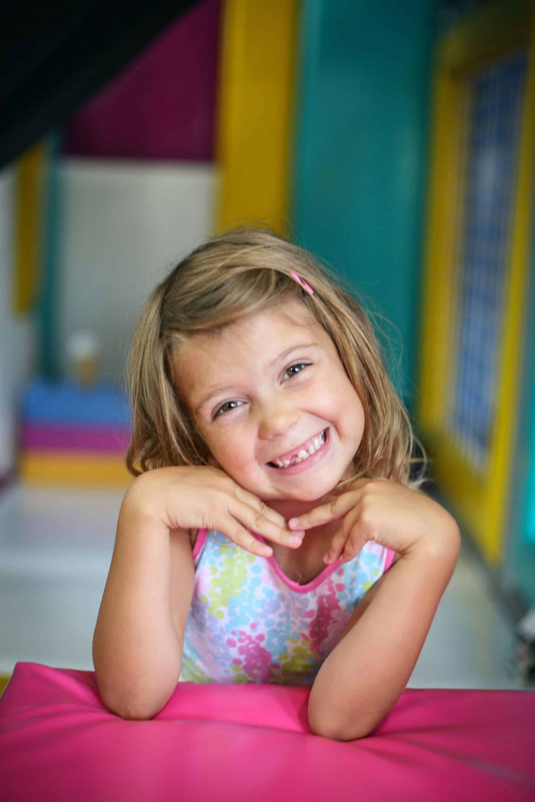 Happy young girl after teeth strengthening for children with fluoride varnish in Lexington, SC